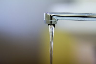 Close-up of faucet with turned drop water
