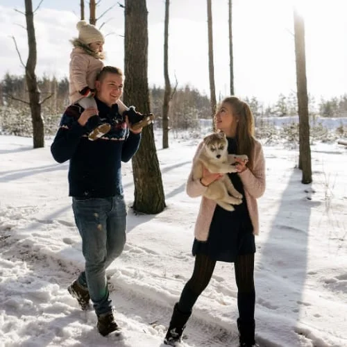 Family Walking With Dog